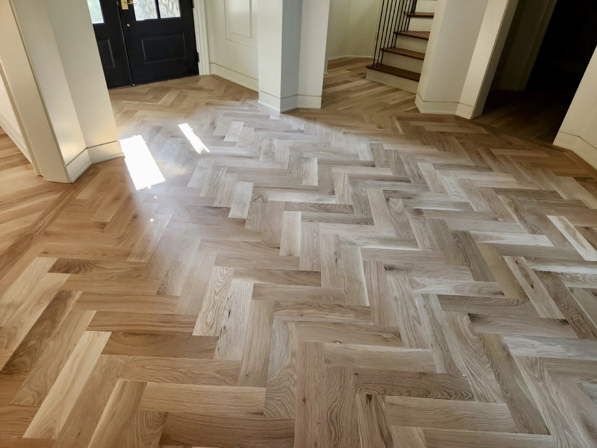 Seasonal gapping between hardwood floor boards in a Northwest Arkansas home during winter