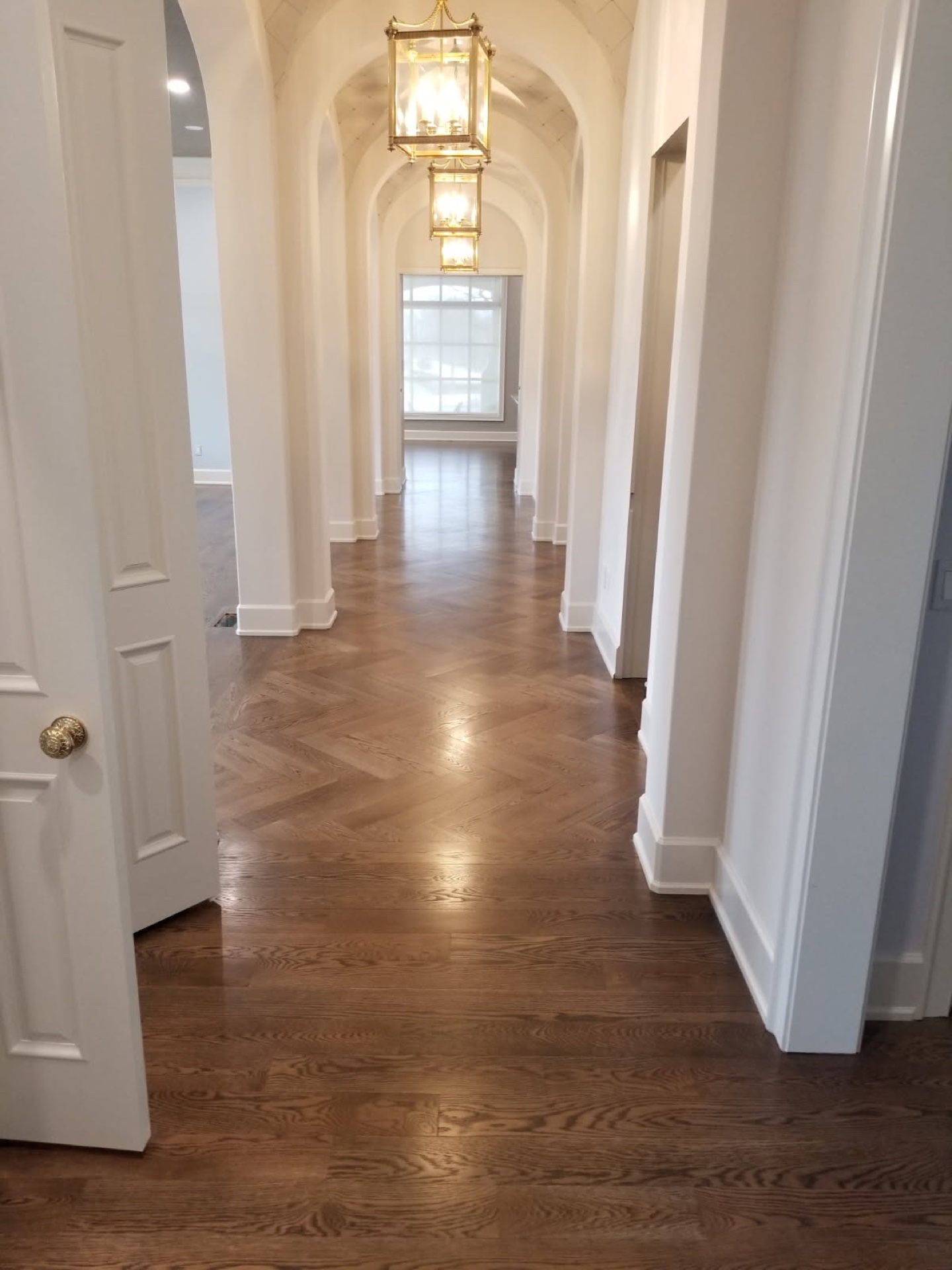 Freshly refinished hardwood floor in a Bentonville home prepared for listing photography