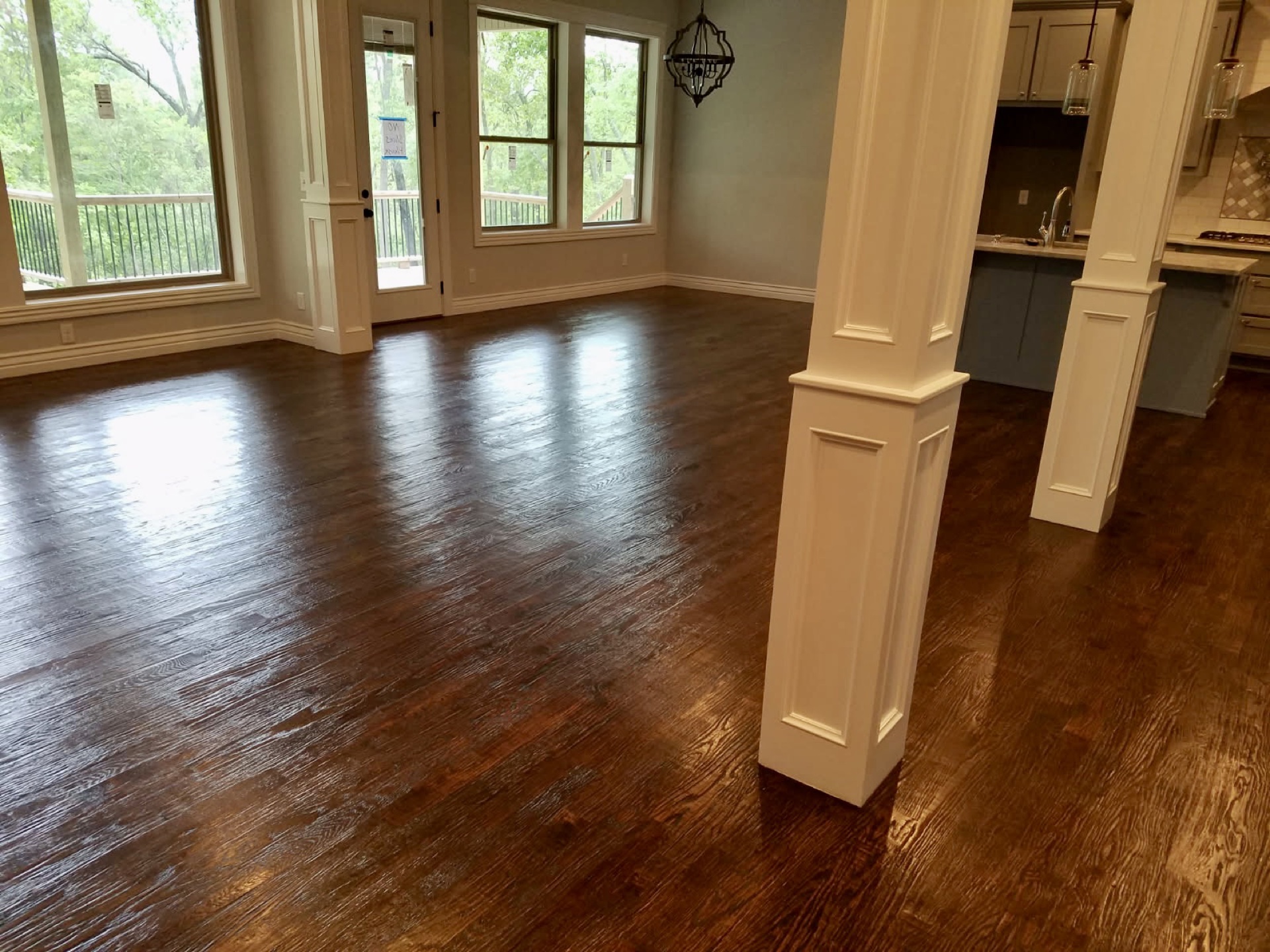 Hardwood floor being screened and recoated by Heritage Hardwood Floors in Northwest Arkansas